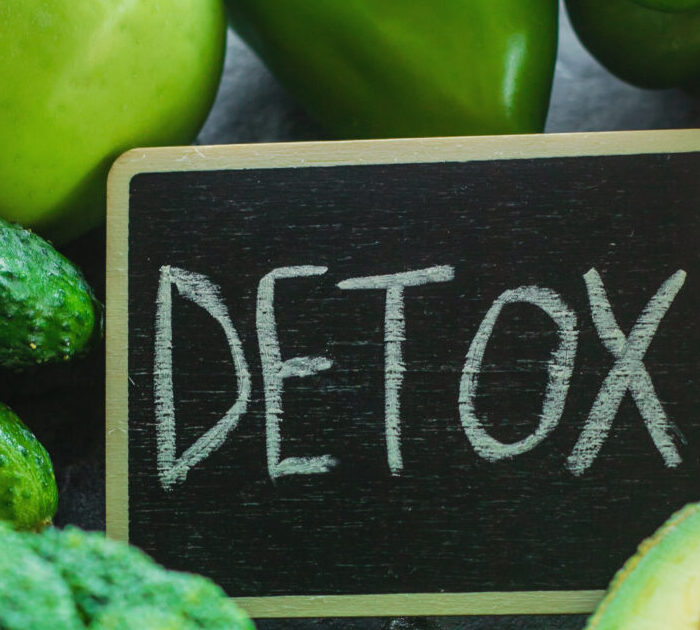 The word Detox Surrounded by Vegetables and fruit